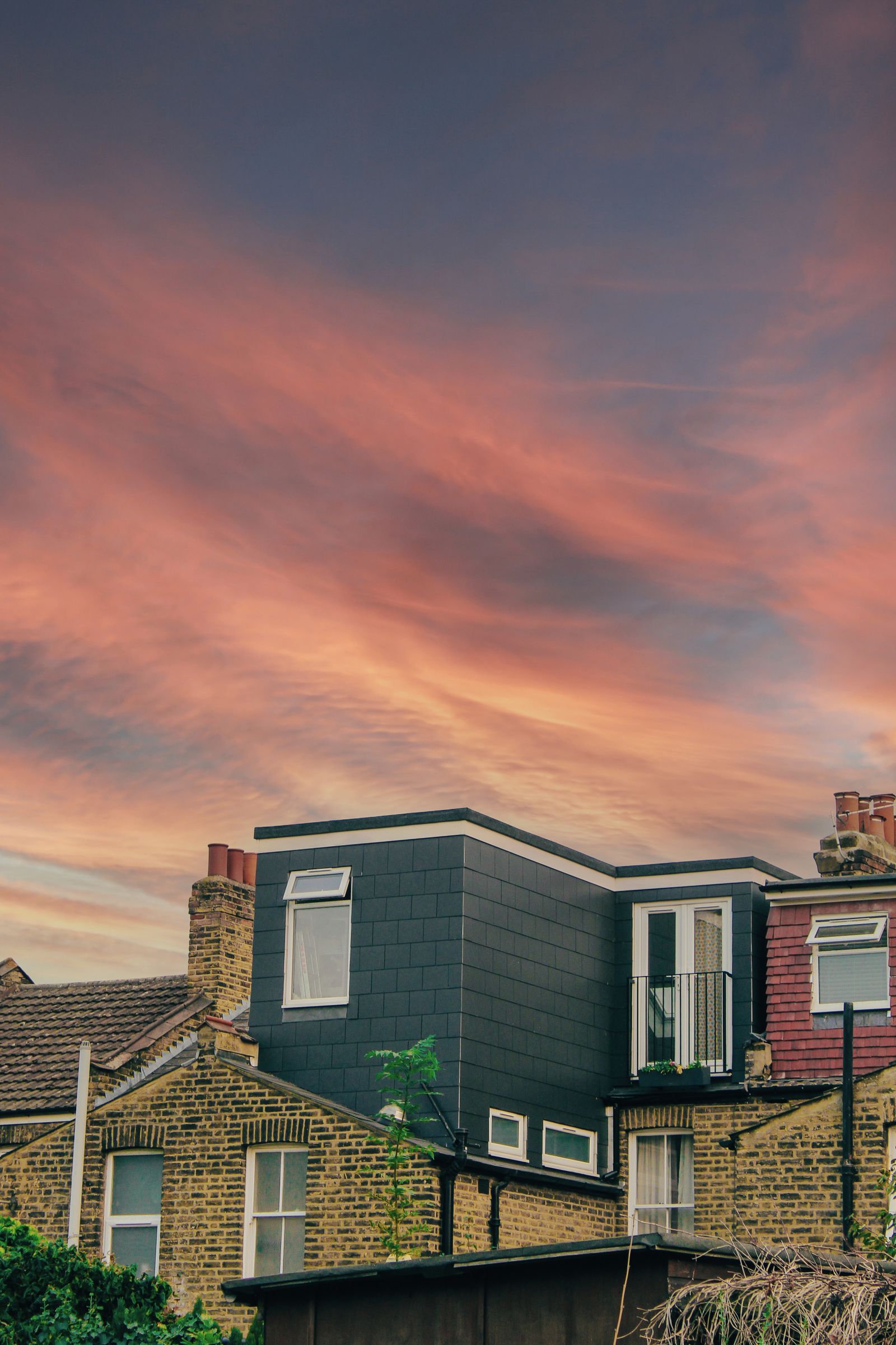 Loft dormer on a London terrace at dusk